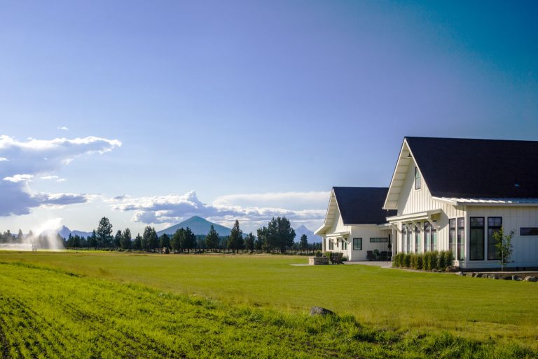 White farmhouse-style residential building in Deschutes County