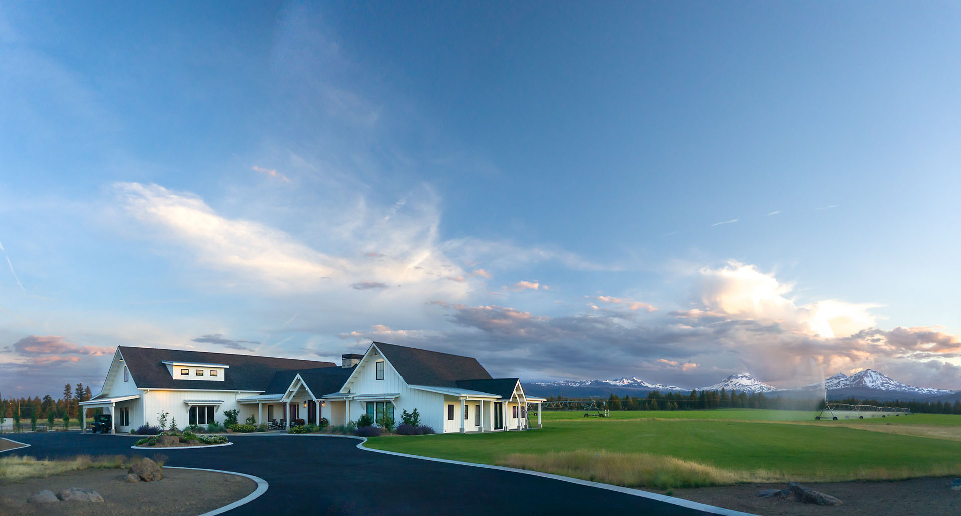Beautiful farmhouse in Sisters, Or with green fields and blue skies