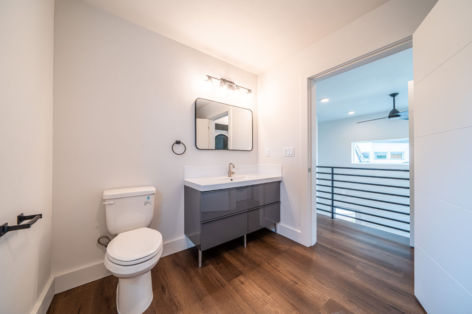 View of the bathroom with vanity and wood flooring