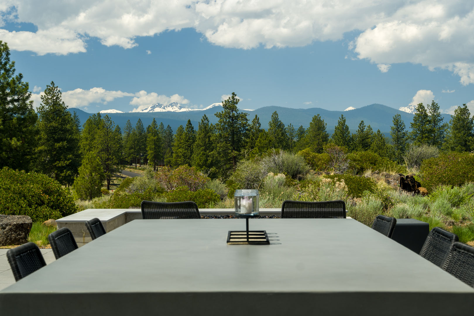 Outdoor view of home with mountains and trees from new build patio