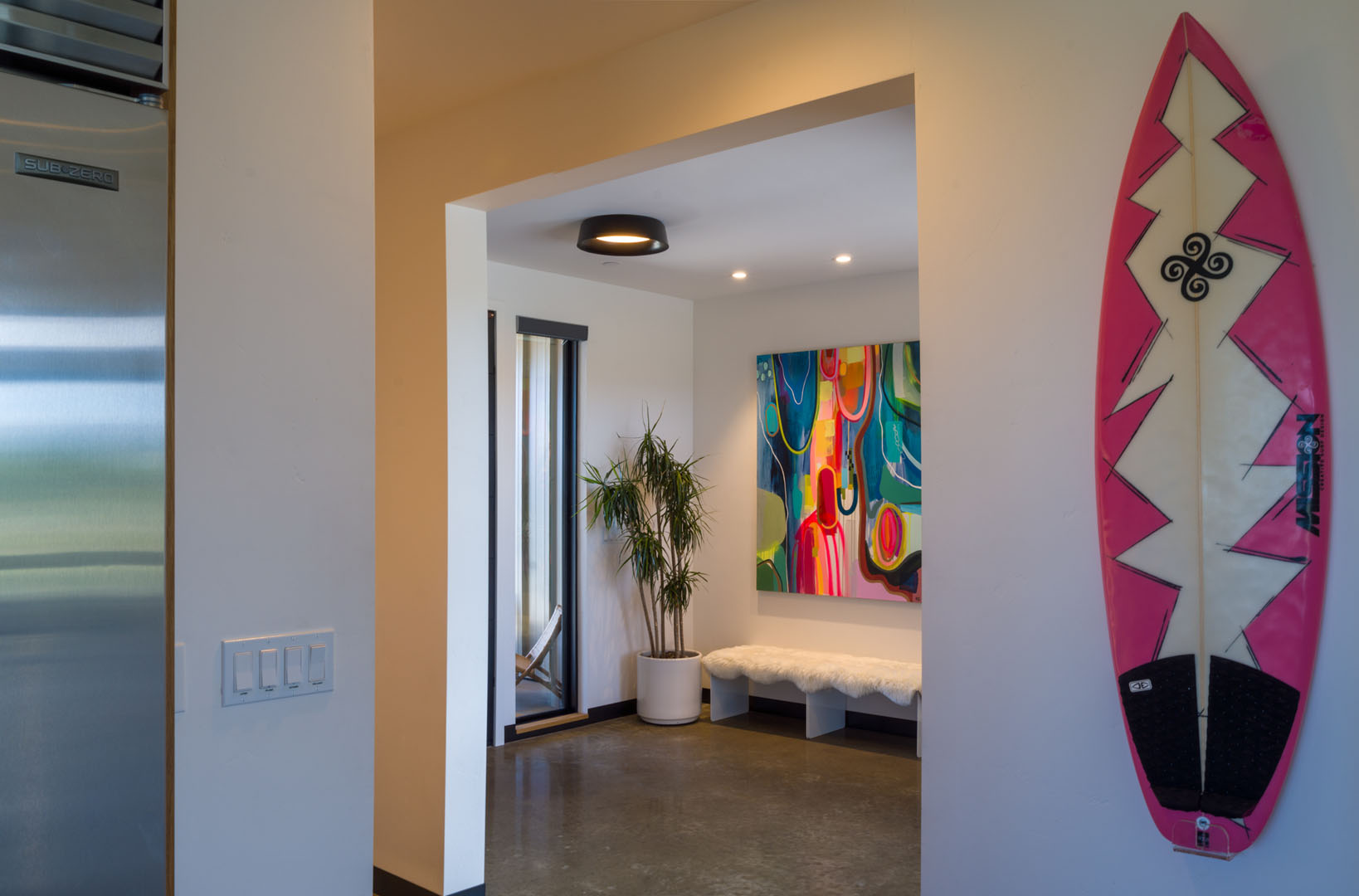 Inside of the contemporary ranch home with kayak as art